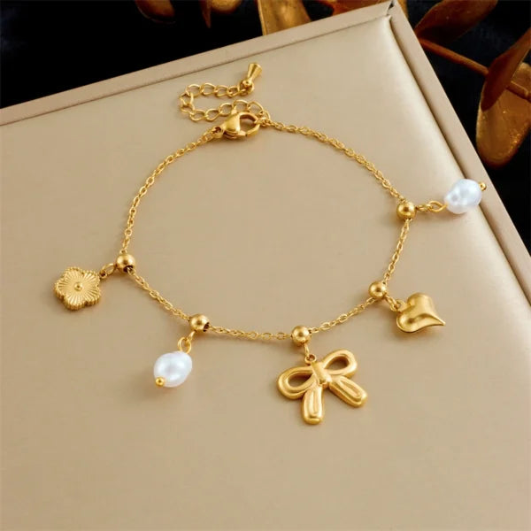Bracelet à Breloques Doré avec Noeud Papillon