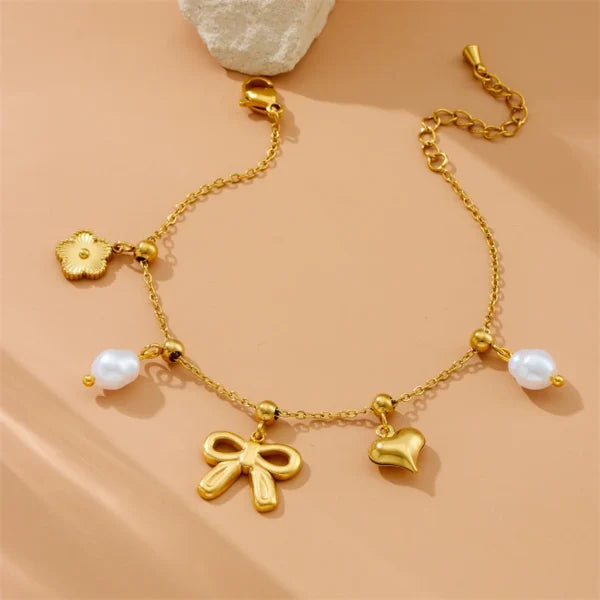 Bracelet à Breloques Doré avec Noeud Papillon