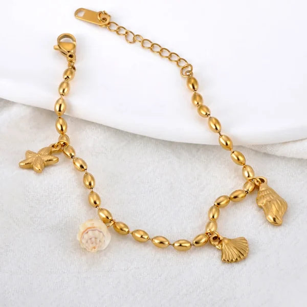 Bracelet doré à Breloques avec Coquillage