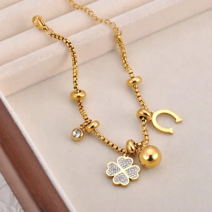 Bracelet Breloques doré avec Trèfle à 4 Feuilles