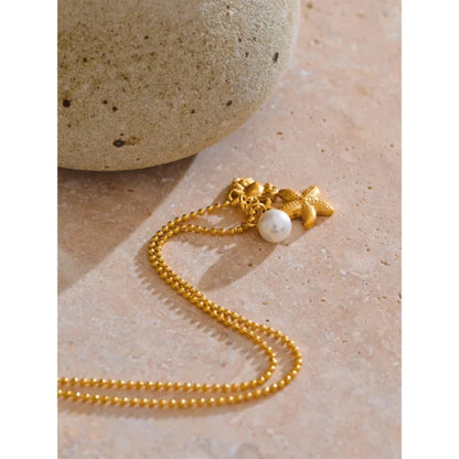 Collier à Breloques Perle, Étoile et Crabe Doré