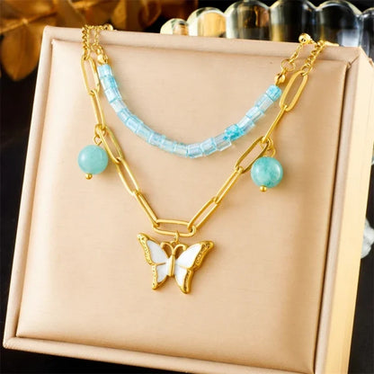 Collier à breloques Papillon Blanc et Perles Bleues