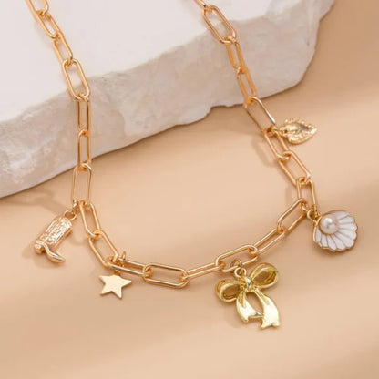 Collier Breloque Nœud Papillon Doré