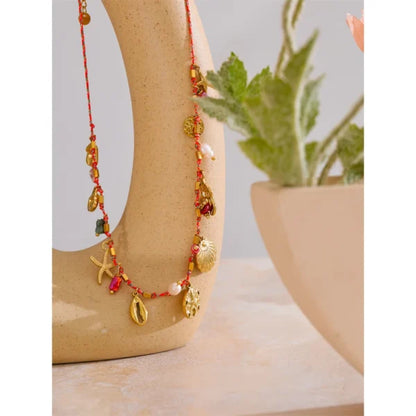 Collier à Breloques Coquillages Dorés