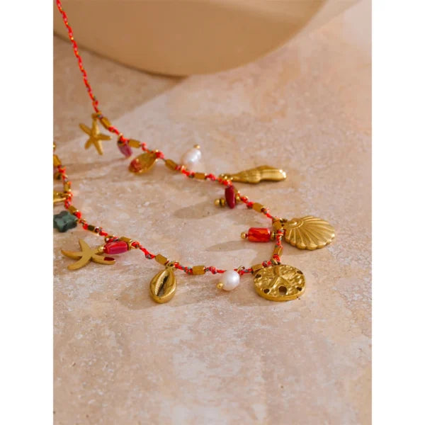 Collier à Breloques Coquillages Dorés