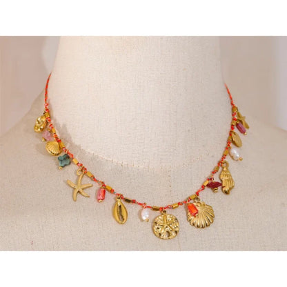 Collier à Breloques Coquillages Dorés