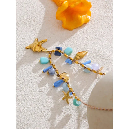 Collier breloques Corail Bleu et Doré