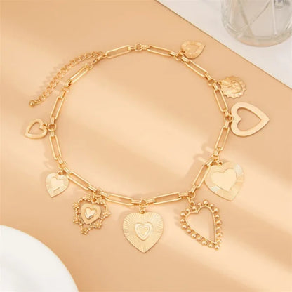 Collier à Breloques Coeurs Majestueux Dorés